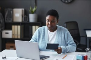 Young African American female manager of visa application canter