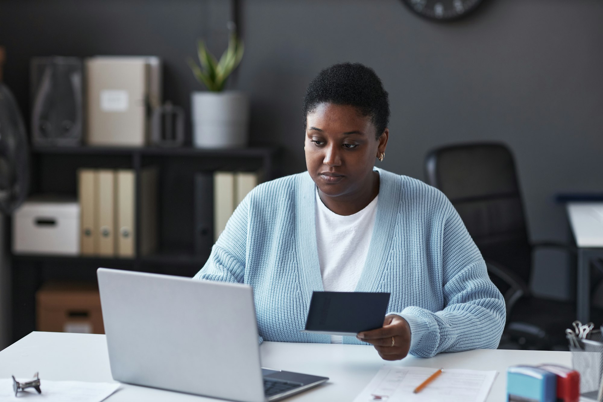 Young African American female manager of visa application canter